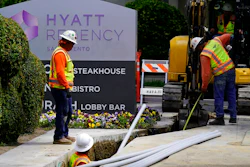 Workers install piping for underground electrical lines in Sacramento, Calif., Wednesday, April 20, 2022. California workplace regulators are poised to extend mandatory pay for workers affected by the coronavirus through the end of 2022, more than two months after state lawmakers restored similar benefits through September.