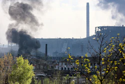 Smoke rises from the Metallurgical Combine Azovstal in Mariupol, in territory under the government of the Donetsk People's Republic, eastern Ukraine, Wednesday, May 4, 2022.