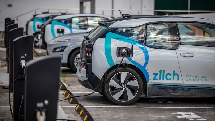 Electric vehicle charging station and car share parking are seen in Auckland, New Zealand, on Aug. 12, 2021. New Zealand will help pay for lower-income families to scrap their old gas guzzlers and replace them with cleaner hybrid or electric cars as part of a sweeping plan to reduce greenhouse gas emissions the government announced Monday May 16, 2022.