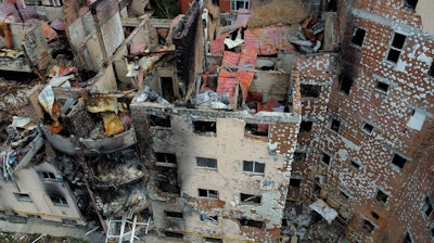 Damaged buildings ruined by attacks are seen in Irpin, on the outskirts Kyiv, Ukraine, Thursday, May 26, 2022.