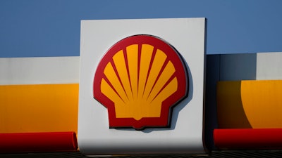 A Shell logo is seen at a petrol station in London, Tuesday, March 8, 2022. Energy giant Shell reported Thursday, May 5, 2022 record first-quarter earnings after a surge in oil prices, fuelling calls for the British government to impose a windfall earnings to assist consumers struggling with the soaring cost of living.