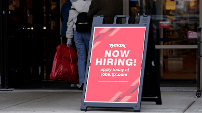 Hiring sign is displayed outside of a retail store in Vernon Hills, Ill., on Nov. 13, 2021.