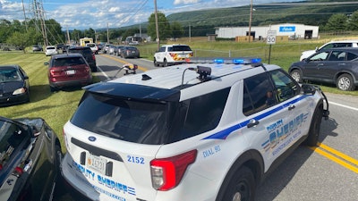 Law enforcement stages near the scene of a shooting at Columbia Machine, Inc., in Smithsburg, Md., Thursday, Jan. 9, 2022.