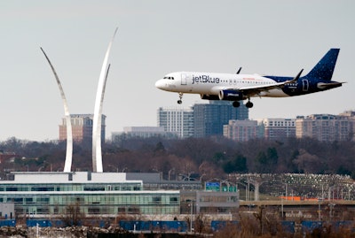 A JetBlue passenger flight lands at Reagan Washington National Airport in Arlington, Va., across the Potomac River from Washington, Wed., Jan. 19, 2022. On Friday, June 17, 2022, federal regulators said Verizon and AT&T will delay part of their 5G rollout near airports to give airlines more time to ensure that equipment on their planes is safe from interference from the wireless signals, but the airline industry is not happy about the deal.