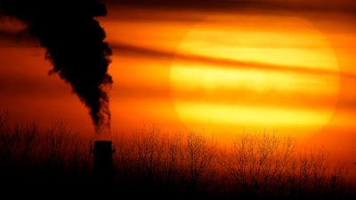 Emissions from a coal-fired power plant are silhouetted against the setting sun in Kansas City, Mo., Feb. 1, 2021. The Supreme Court on Thursday, June 30, 2022, limited how the nation’s main anti-air pollution law can be used to reduce carbon dioxide emissions from power plants. By a 6-3 vote, with conservatives in the majority, the court said that the Clean Air Act does not give the Environmental Protection Agency broad authority to regulate greenhouse gas emissions from power plants that contribute to global warming.