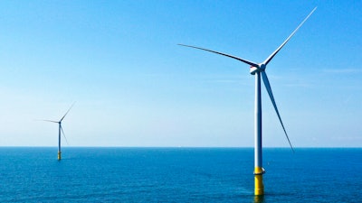 Two of the offshore wind turbines which have been constructed off the coast of Virginia Beach, Va. are seen on June 29, 2020. The White House is launching a formal partnership with 12 East Coast governors to boost the growing offshore wind industry. It's a key element of President Joe Biden's plan for climate change.