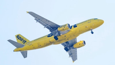 A Spirit Airline aircraft approaches Philadelphia International Airport Friday, Oct. 22, 2021. A firm that advises investors on proxy voting said Tuesday, May 31, 2022, that Spirit shareholders should oppose Frontier Airlines’ bid to buy Spirit, saying that JetBlue has made a better offer.