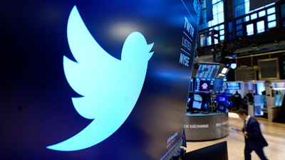 The logo for Twitter appears above a trading post on the floor of the New York Stock Exchange, Nov. 29, 2021. Twitter's stock slid more than 6% before the market open Monday, July 11, 2022, after billionaire Elon Musk announced late Friday that he will abandon his $44 billion offer to buy Twitter and the company said it will sue the Tesla CEO to uphold the deal.