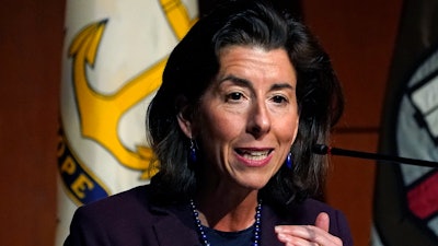 U.S. Secretary of Commerce Gina Raimondo speaks during an address at Brown University, March 15, 2022, in Providence, R.I. The Biden administration and congressional Democrats are warning of dire ramifications for the economy and for national security if Congress fails to pass a bill by the end of July that is designed to boost semiconductor manufacturing in the United States. Raimondo says computer chip makers are being offered lucrative incentives from other countries such as South Korea, Japan, France, Germany and Singapore to locate plants there.