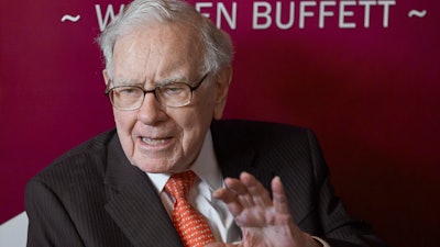 In this May 5, 2019, file photo, Warren Buffett, Chairman and CEO of Berkshire Hathaway, speaks during a game of bridge following the annual Berkshire Hathaway shareholders meeting in Omaha, Neb.