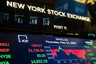 Screens display end-of-day trading results at the New York Stock Exchange on May 12, 2022, in New York.