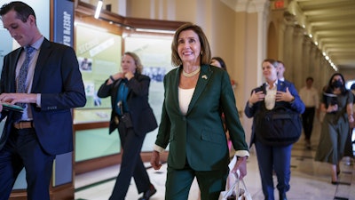 House Speaker Nancy Pelosi, D-Calif., walks to her office after the House aligned the bipartisan chips bill designed to encourage more semiconductor companies to build chip plants in the United States, at the Capitol in Washington, Thursday, July 28, 2022.