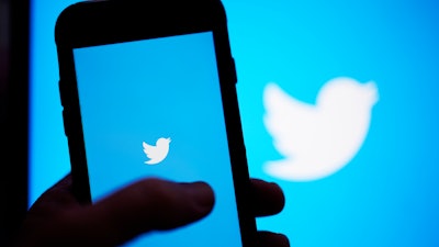 The Twitter application is seen on a digital device, April 25, 2022, in San Diego. Twitter said Tuesday, July 12, 2022, that it has sued Elon Musk to force him to complete the $44 billion acquisition of the social media company.