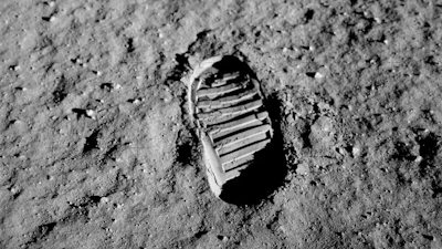 A layer of fine dust and sharp rock shards covers the surface of the Moon, as shown in this photo taken by Buzz Aldrin in 1969.