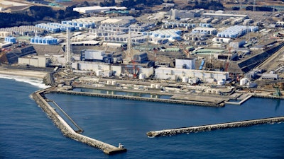 This aerial photo shows Fukushima Daiichi nuclear power plant in Okuma town, Fukushima prefecture, north of Tokyo, on Feb. 13, 2021. The construction of facilities needed for a planned release of treated radioactive wastewater into the sea next year from the damaged Fukushima nuclear power plant began Thursday, Aug. 4 ,2022, despite opposition from the local fishing community.