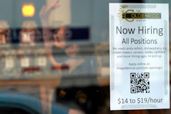 Sign advertising for help at The Goldenrod restaurant and candy shop, York Beach, Maine, June 1, 2022.
