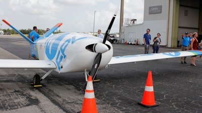 Florida Power and Light unveils its new fixed-wing drone designed to fly into tropical storm force winds to help expedite power restoration, Wednesday, Aug. 10, 2022, West Palm Beach, Fla. The company says a drone of this scale is the first of its kind to be used outside of an FAA test site for research and development. The drone, named FPLAir One, resembles a small plane that is remotely operated, allowing the company to scan and capture visuals for up to 1,000 miles on a single flight.