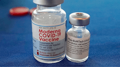 This Sept. 21, 2021 file photo shows vials of the Pfizer and Moderna COVID-19 vaccines in Jackson, Miss.