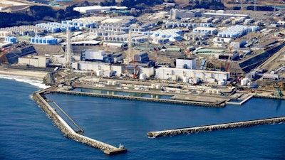 This aerial photo shows Fukushima Daiichi nuclear power plant in Okuma town, Fukushima prefecture, north of Tokyo, on Feb. 13, 2021. The construction of facilities needed for a planned release of treated radioactive wastewater into the sea next year from the damaged Fukushima nuclear power plant began Thursday, Aug. 4 ,2022, despite opposition from the local fishing community.