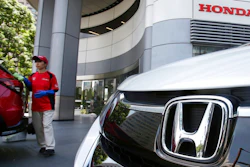 An employee of Honda Motor Co. cleans a Honda car displayed at its headquarters in Tokyo on July 31, 2018. Honda’s fiscal first quarter profit fell 33% from 2021 as a global computer chip shortage, a pandemic-related lockdown in China and the rising costs of raw materials hurt the Japanese automaker. Tokyo-based Honda Motor Co. reported Wednesday, Aug. 10, 2022, that its profit totaled 149.2 billion yen ($1.1 billion) in the April-June quarter, down from 222.5 billion yen ($1.7 billion) a year earlier. Quarterly sales slipped 7% to 3.8 trillion yen ($28 billion).