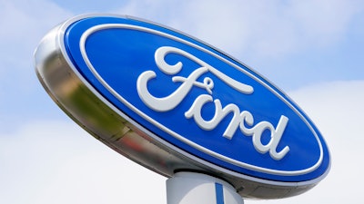 A Ford sign is shown at a dealership in Springfield, Pa., Tuesday, April 26, 2022.
