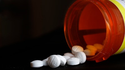 An arrangement of Oxycodone pills sit next to a bottle in New York on Aug. 29, 2018.
