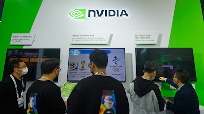 Visitors stop by the booth of Nvidia at the Apsara Conference, an annual cloud service technology forum hosted by Alibaba Group, in Hangzhou in eastern China's Zhejiang province Tuesday, Oct. 19, 2021.