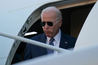 President Joe Biden steps from Air Force One as he and first lady Jill Biden arrive at Delaware Air National Guard Base in New Castle, Del., Tuesday, Sept. 13, 2022, to travel to Wilmington, Del.