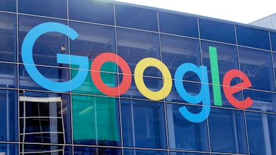 In this Sept. 24, 2019, file photo a sign is shown on a Google building at their campus in Mountain View, Calif.