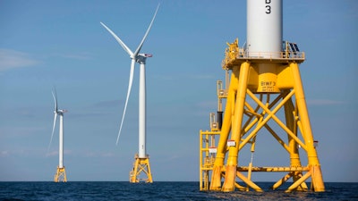 Offshore wind turbines stand near Block Island, R.I. on Aug. 15, 2016. The Biden administration says it will hold its first offshore wind auction next month. It's offering nearly 500,000 acres off the coast of New York and New Jersey for wind energy projects that could produce enough electricity to power nearly 2 million homes.