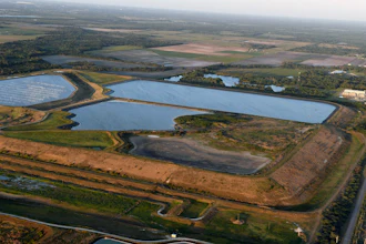 This aerial photo taken from an airplane shows a reservoir near the old Piney Point phosphate mine on April 3, 2021, in Bradenton, Fla.