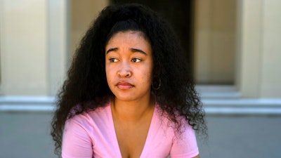 Marina Aina, a 21-year-old student majoring in American Studies at Pomona College, poses for photos on the school's campus in Claremont, Calif., Thursday, Sept. 22, 2022. Aina was used to getting paid for her internships and could not see taking an unpaid opportunity over a summer job. 'If I felt that it wasn't compensated then I wouldn't go for it because I wouldn't have the funds to cover it,' Aina says. 'I wouldn't want to ask my parents, who are helping me pay for college, to pay for something I'm doing over the summer.'