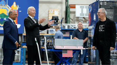 President Joe Biden speaks as he looks at IBM chips, mainframes and memory cards during a tour of an IBM facility with IBM Chairman and CEO Arvind Krishna, left, in Poughkeepsie, N.Y., on Thursday Oct. 6, 2022.