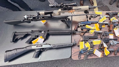 This photo, provided by the Office of New York Attorney General Letitia James, on Aug. 28, 2022 shows some of the 296 firearms, including 177 ghost guns, that were surrendered to law enforcement at a gun buy-back event hosted by her office and the Utica, NY, Police Department.