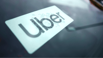 An Uber sign is displayed inside a car in Palatine, Ill., Thursday, Feb. 10, 2022.