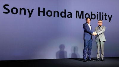 Izumi Kawanishi, left, the Sony executive who became Chief Operating Officer at Sony Mobility and Chief Executive Yasuhide Mizuno pose for a photo during a news conference in Tokyo Thursday, Oct. 13, 2022.