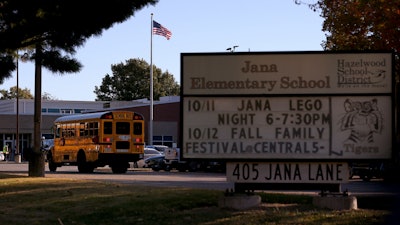 A school bus arrives at Jana Elementary School on Monday, Oct. 17, 2022 in Florissant, Mo.