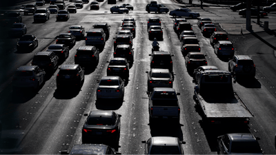 Cars wait at a red light during rush hour on the Las Vegas Strip in Las Vegas, April 22, 2021.