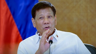 In this photo provided by the Malacanang Presidential Photographers Division, Philippine then President Rodrigo Duterte meets cabinet officials at the Malacanang presidential palace in Manila, Philippines on March 7, 2022.