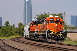 A BNSF locomotive heads south out of Oklahoma City, Wednesday, Sept. 14, 2022. A fifth rail union has approved its deal with the freight railroads to secure 24% raises and $5,000 in bonuses and a sixth one is set to vote Thursday. But all 12 rail unions must ratify their contracts to prevent a strike.