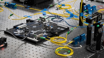 Devices like this experimental apparatus can produce pairs of photons that are linked, or 'entangled.'