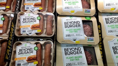 Packages of Beyond Meat's Beyond Burgers and Beyond Sausage, are shown in this photo, in New York, on April 29, 2021.