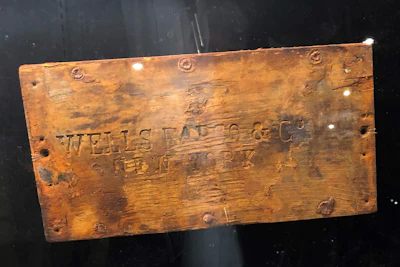 In this undated photo provided by Holabird Western Americana Collections is a lid to a Wells Fargo treasure shipment box, recovered from the fabled 'Ship of Gold,' the S.S. Central America that sank in 1857. The lid was sold at auction for $99,600 by Holabird Western Americana Collections in Reno, Nevada on December 3, 2022.