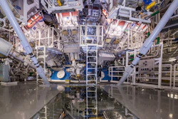 This undated image provided by the National Ignition Facility at the Lawrence Livermore National Laboratory shows the NIF Target Bay in Livermore, Calif. The system uses 192 laser beams converging at the center of this giant sphere to make a tiny hydrogen fuel pellet implode.
