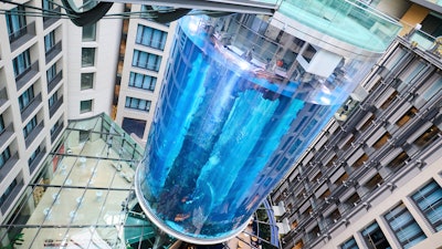 The AquaDom aquarium at the Sea Life tourist attraction photographed in Berlin, Wednesday, June 1, 2022. The aquarium is bursts on Friday, Dec. 16, 2022. Operators say the aquarium has the biggest cylindrical tank in the world. It contained 1,500 tropical fish before the incident.