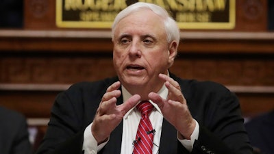 West Virginia Gov. Jim Justice delivers his annual State of the State address in the House Chambers at the state Capitol in Charleston, W.Va., Jan. 8, 2020.