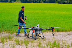 Operator introduces XAG P100 Agricultural Drone to rice farmers.