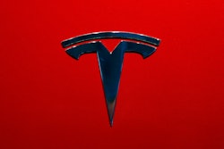 The logo of Tesla model 3 is seen at the Auto show on Oct. 3, 2018, in Paris.