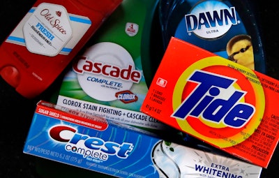 In this June 15, 2018, file photo a variety of Procter & Gamble products rest on a counter in East Derry, N.H. Procter & Gamble Co., raised its full-year sales outlook though it cautioned that higher commodity prices continue to squeeze profits.