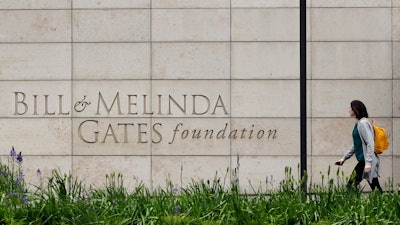 A person walks by the headquarters of the Bill and Melinda Gates Foundation on April 27, 2018, in Seattle.